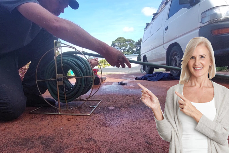 
Efficiently concluding a day of gutter rinsing, a nowra specialist winds up the hose.