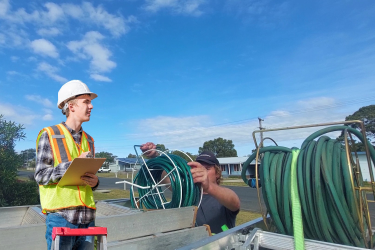 
Hose loading underway as nowra gutter cleaner finishes gutter rinsing.